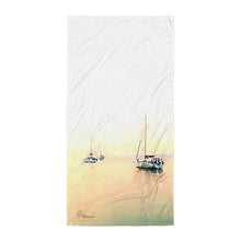 Load image into Gallery viewer, Luxurious beach towel inspired by Aegean Sea sailing, featuring nautical design elements and soft, high-quality fabric laid out on a sandy beach