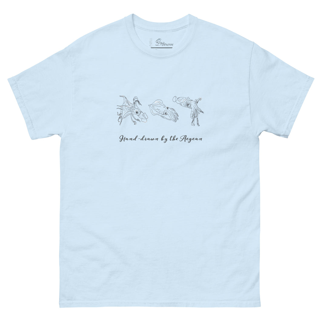 Mockup of a light blue t-shirt with hand-drawn illustrations of squids and calamari on the front, along with the phrase 'Hand-drawn by the Aegean'