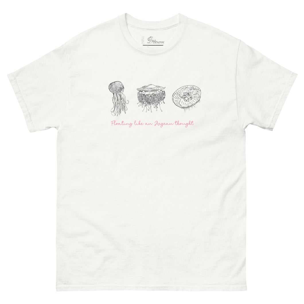 Mockup of a white t-shirt displayed flat, featuring minimalist line art of jellyfish and the phrase 'Floating like an Aegean thought' on the front