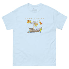 Load image into Gallery viewer, Light blue unisex classic cotton T-shirt featuring the text "Come Closer" with a hand-drawn illustration of Odysseus sailing past the Sirens, inspired by Book XII of Homer's Odyssey.
